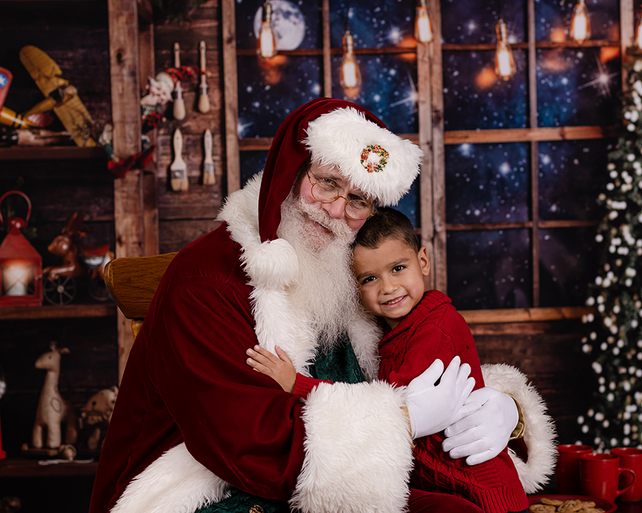 little boy hugging santa